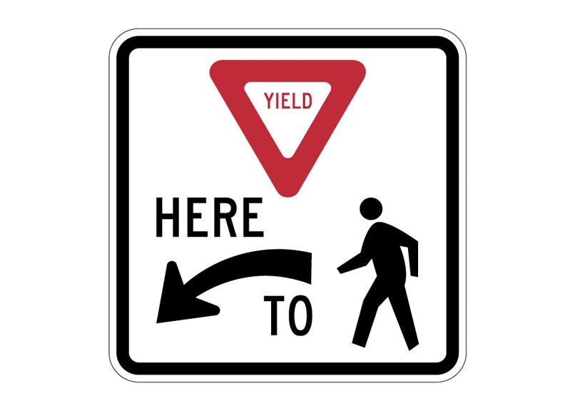 Yield To Pedestrians Here Sign
